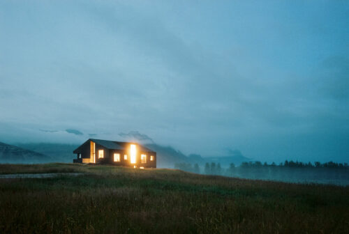 Twilight analogue photography home in Iceland Hofn grass field