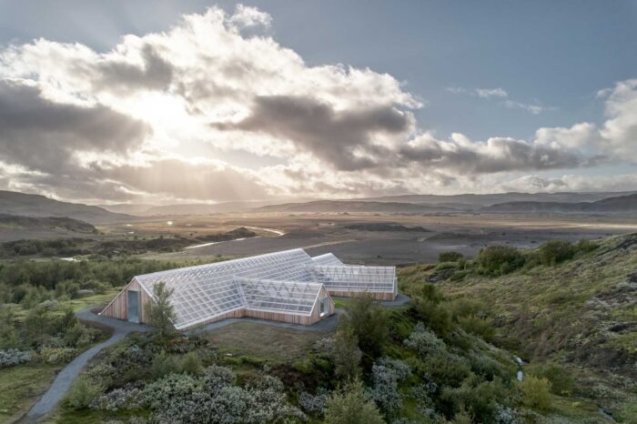 A-frame wooden building with plexiglass roof in Iceland