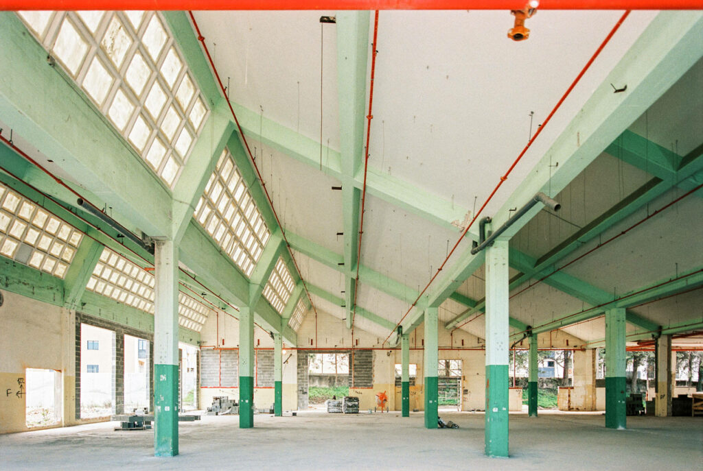 Modernist interior architecture of large warehouse with tilted roof