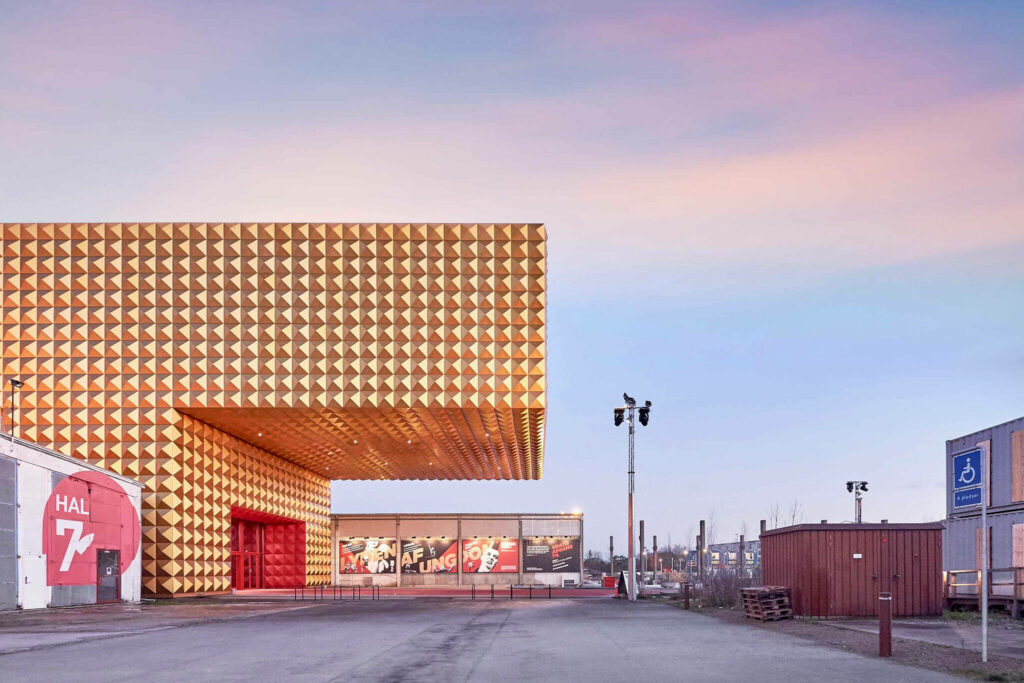 Golden façade building in Roskilde, Denmark with pointy structures