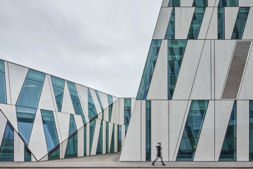 Futuristic building in Copenhagen, Denmark with large asymmetrical windows