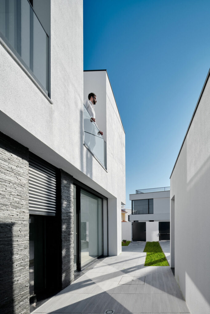 Modern architecture single family home with white walls and black tiles