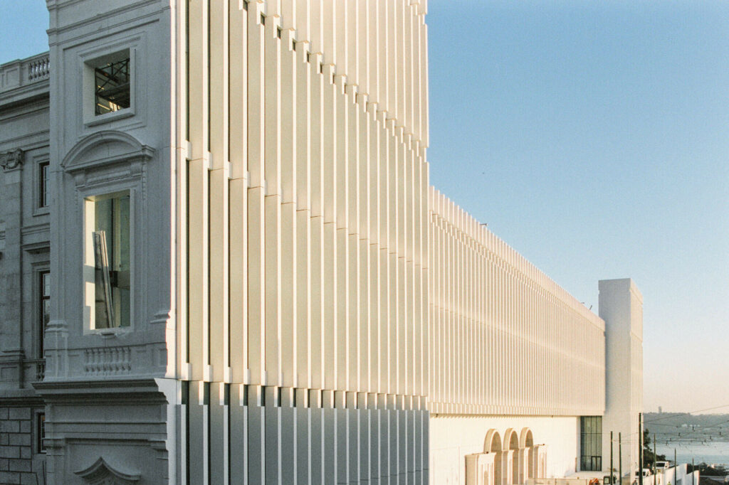 Modern architecture building with vertical white columns and views over the river in Lisbon, Portugal