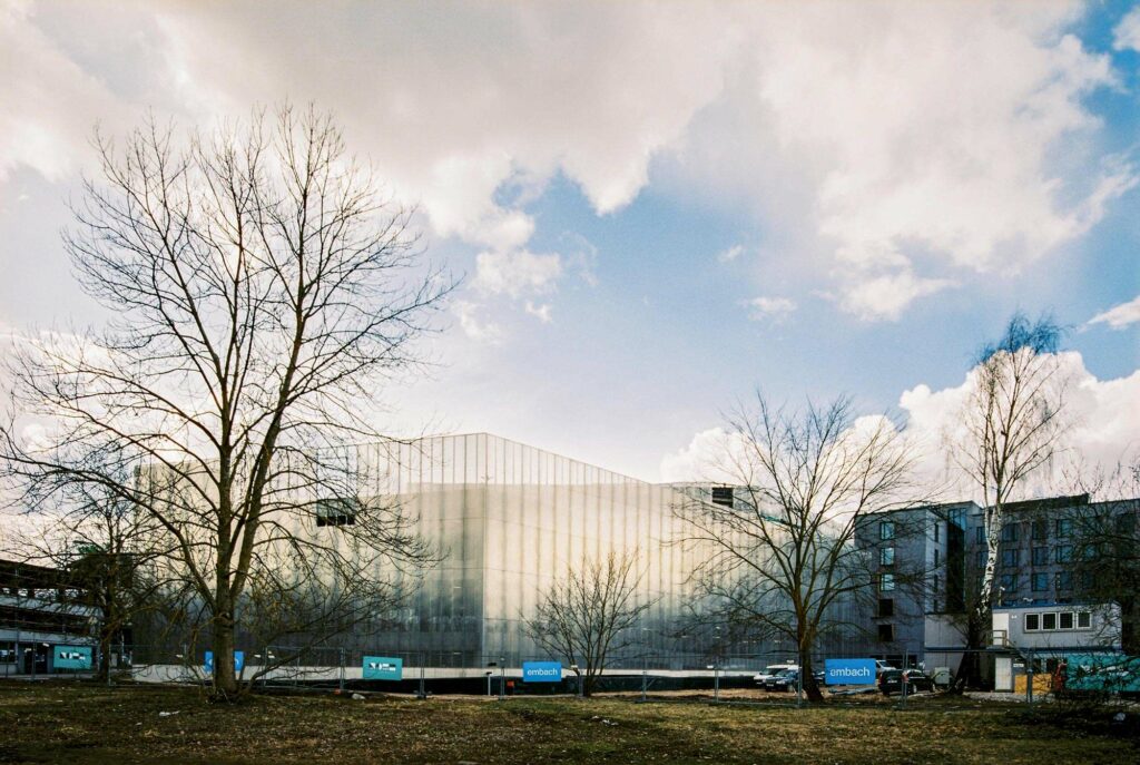 Construction site in Tartu, Estonia with large perforated metal façade