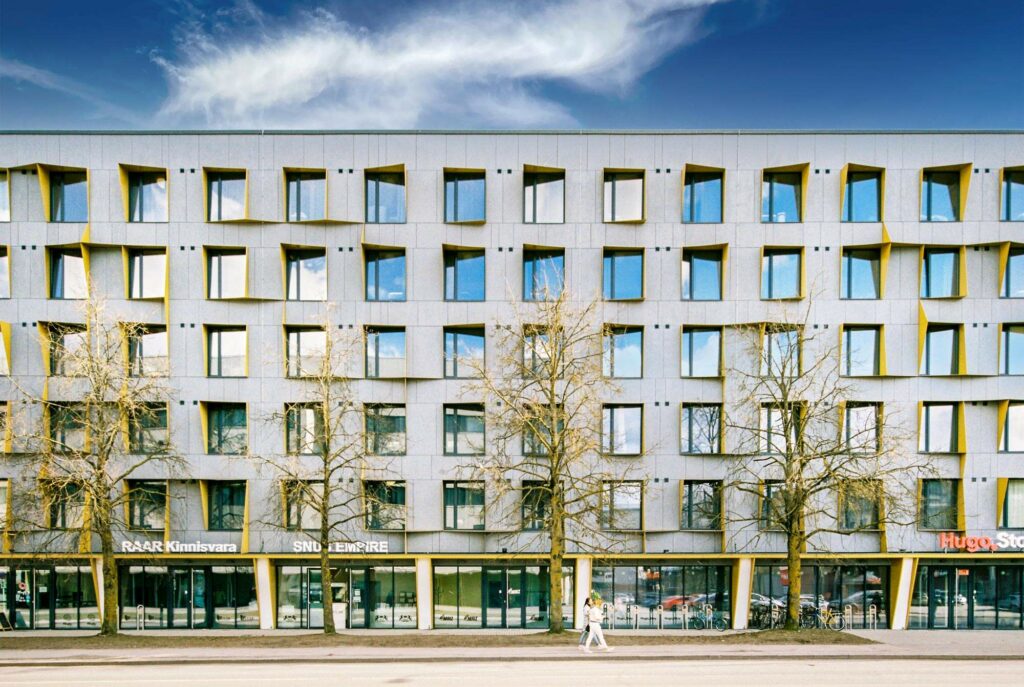 Large building with yellow window frames in Tartu, Estonia