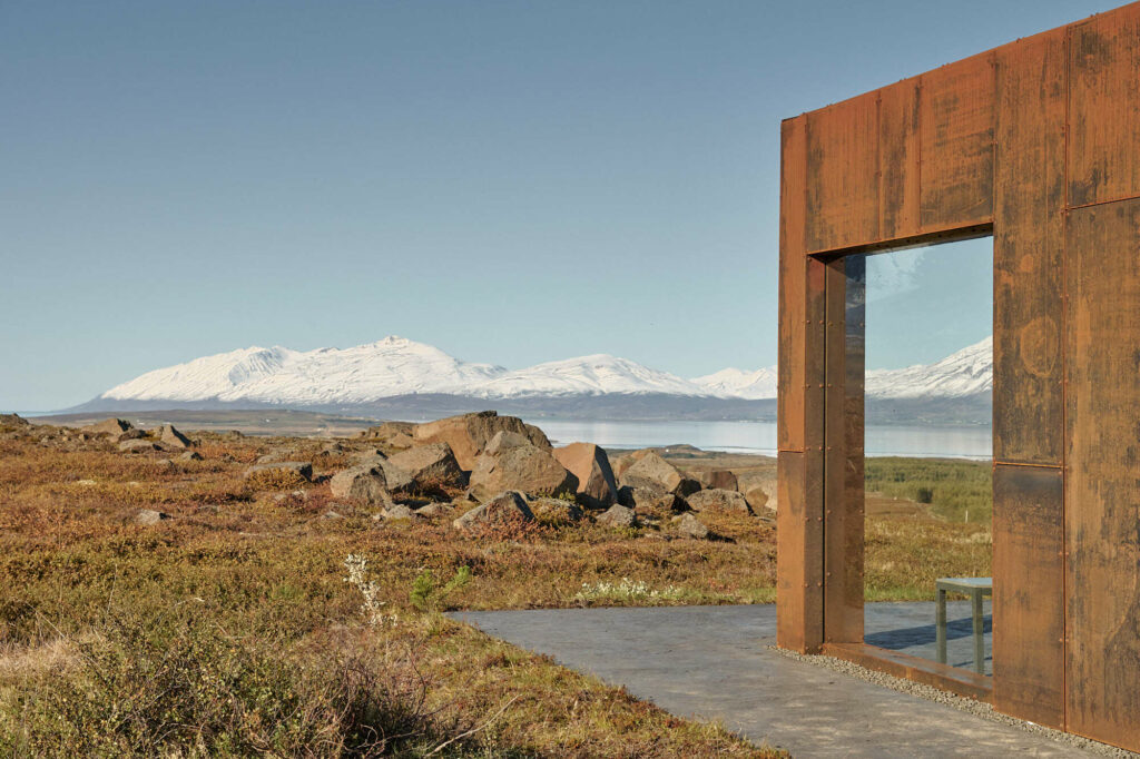 Modern architecture building with corrugated metal and snowy mountains in the background